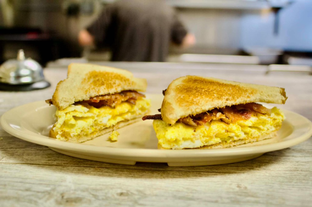 Bacon and egg breakfast sandwich on toast